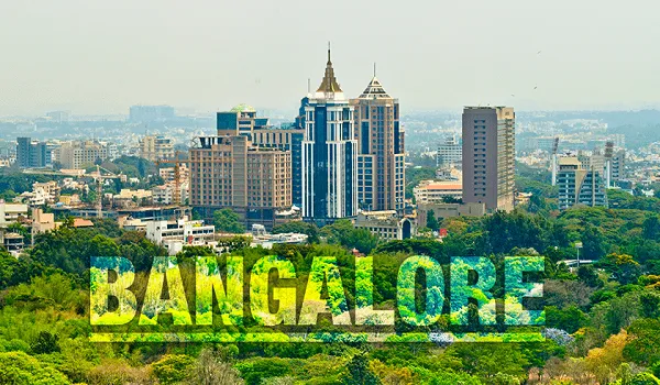 Bengaluru city skyline with high-rise buildings and green tree cover