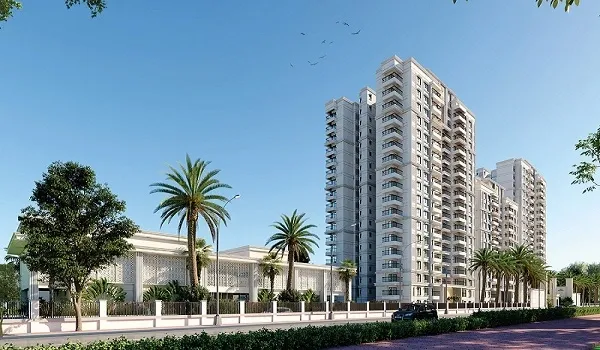 Prestige Airport Road high-rise apartment towers with palm-lined boundary in Devanahalli
