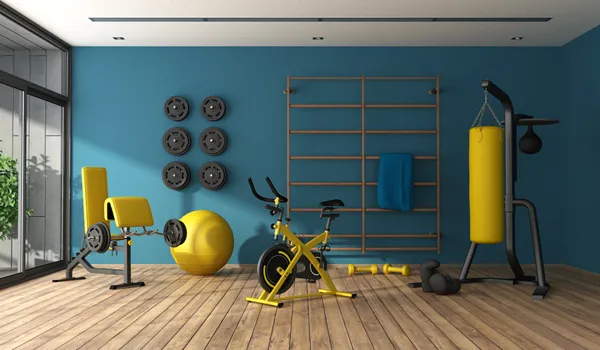 Fitness room with exercise bike, weights and punching bag