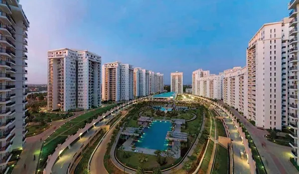 High-rise residential community with a landscaped podium and pool in Bangalore